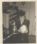 Oakville resident Mrs. Marlatt displays ship's bell and chronometer