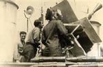 Gunners with aft pom-pom gun on corvette